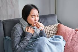 Person experiencing a cough — cough is a symptom, not a disease